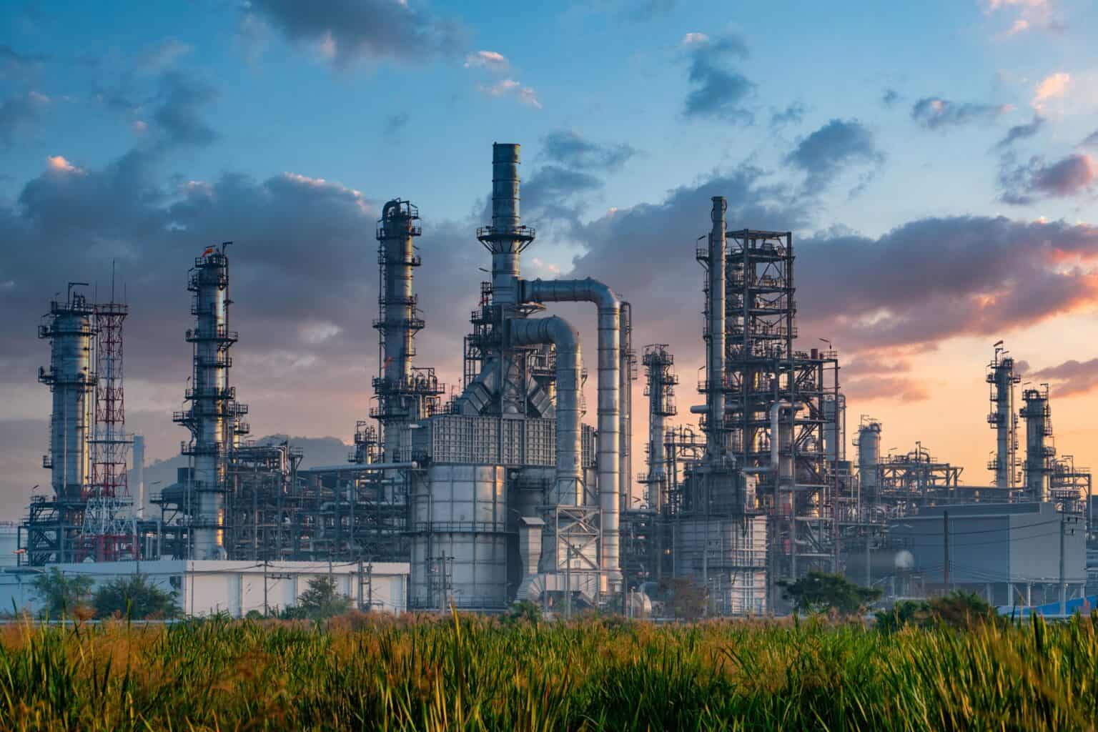 A petrochemical complex at twilight — the industrial backbone of the families Family Ventures partners with